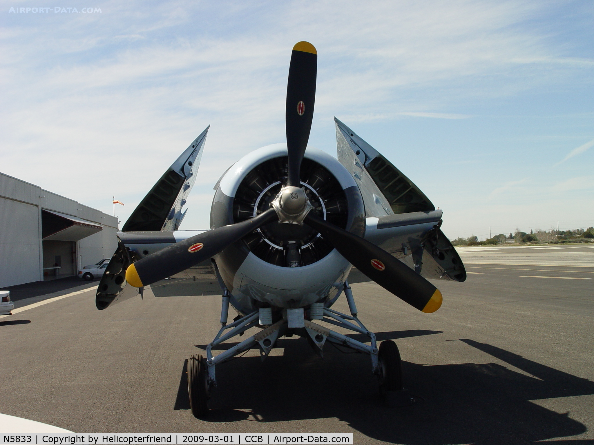 N5833, 1945 General Motors (Grumman) FM-2 Wildcat C/N 5833, Parked with folded wings while hanger being cleaned