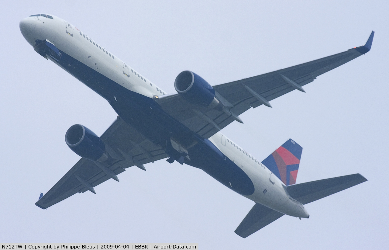 N712TW, 1997 Boeing 757-2Q8 C/N 27624, Wingleted -757 (ex-AA) climbing through the Brussels morning gloom.