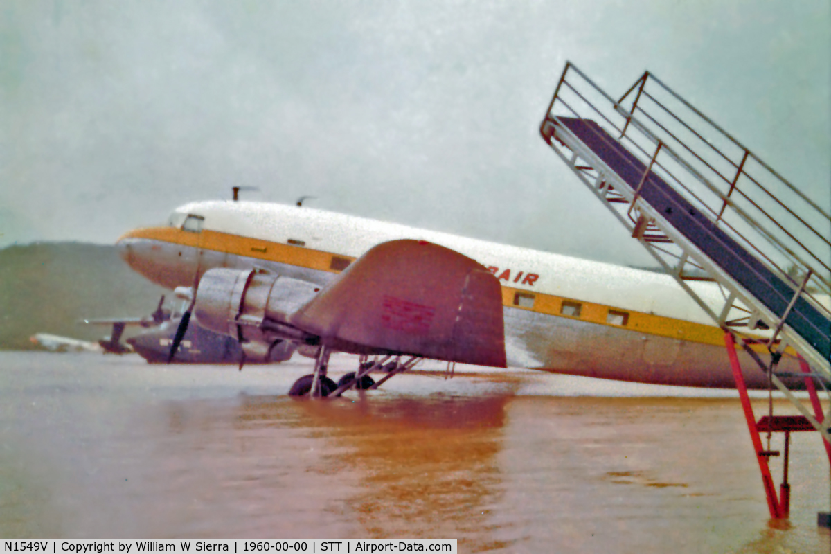 N1549V, 1952 Douglas DC-3 C/N 13480, Flash flood created a small lake in Harry S. Truman Airport. Aircraft was declared a total loss after a take-off accident on 09/55/64