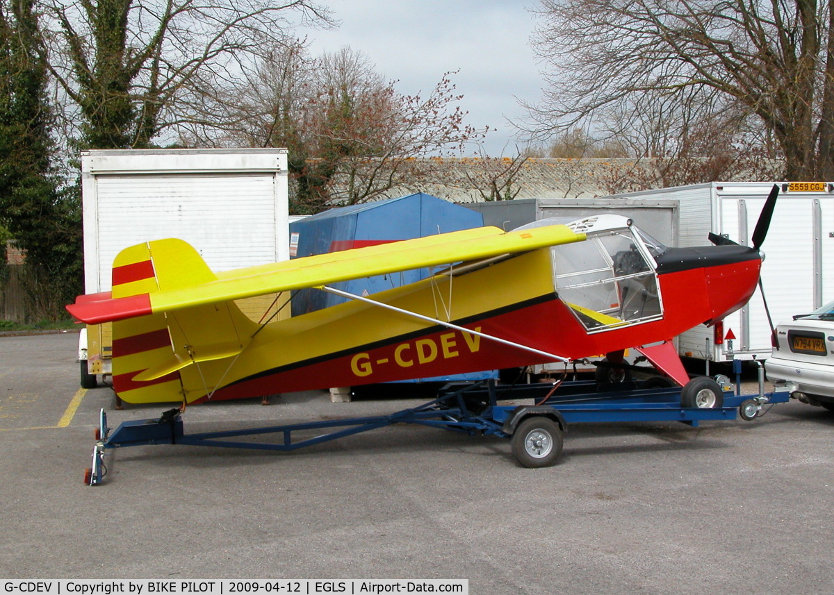 G-CDEV, 2004 Reality Escapade 912(1) C/N BMAA/HB/360, ESCAPADE FOLDED UP ON IT'S TRAILER, THE TWO PHOTOS OF THIS AIRCRAFT TAKEN BY STEVE STAUNTON AT POPHAM WERE TAKEN EARLIER ON THE SAME DAY BUT BY THE TIME THE AIRCRAFT ARRIVED AT OLD SARUM THE REAR OF THE TRAILER HAD COLLAPSED !.