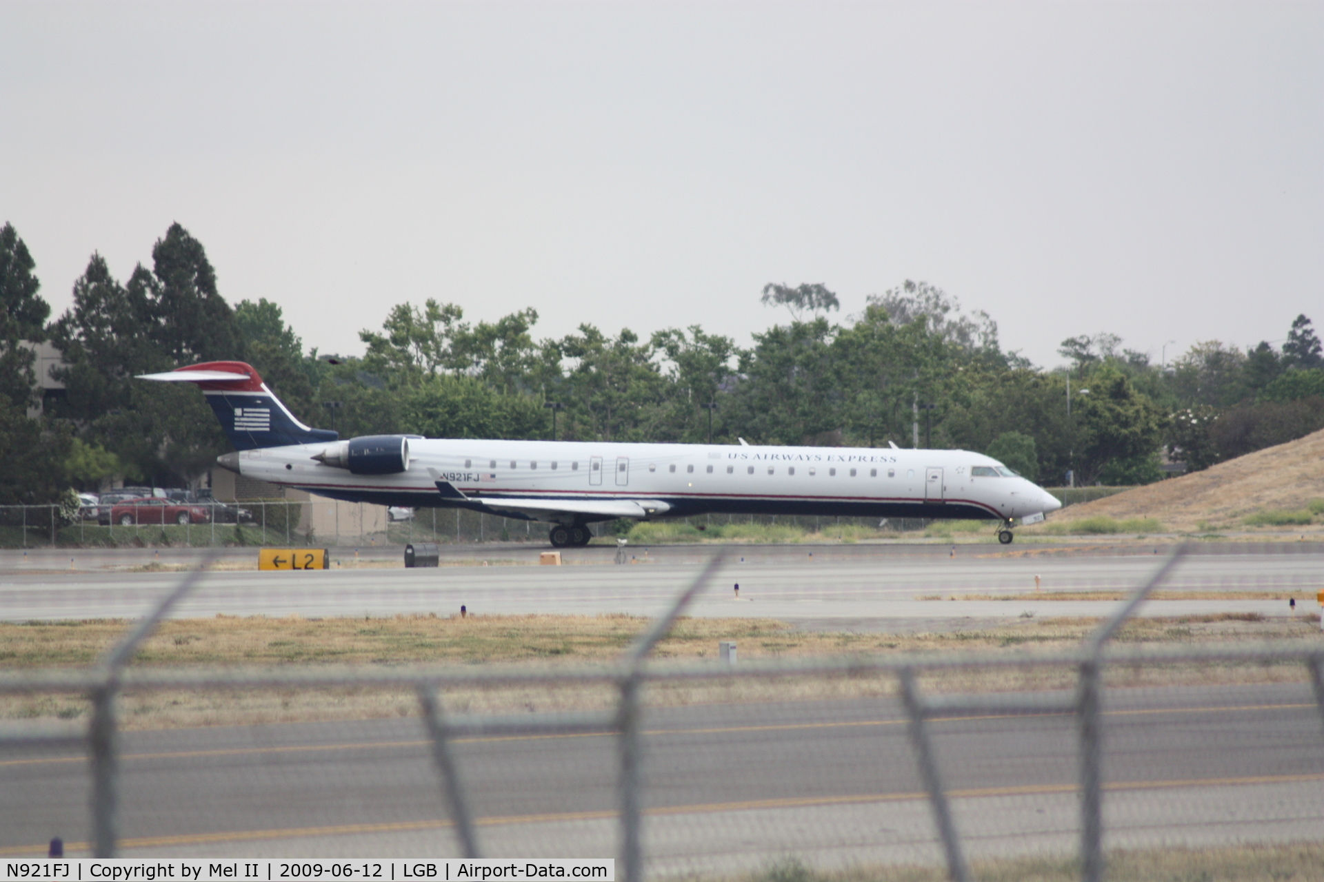N921FJ, 2004 Bombardier CRJ-900ER (CL-600-2D24) C/N 15021, ASH2766 - LGB-PHX - Departing RWY 30