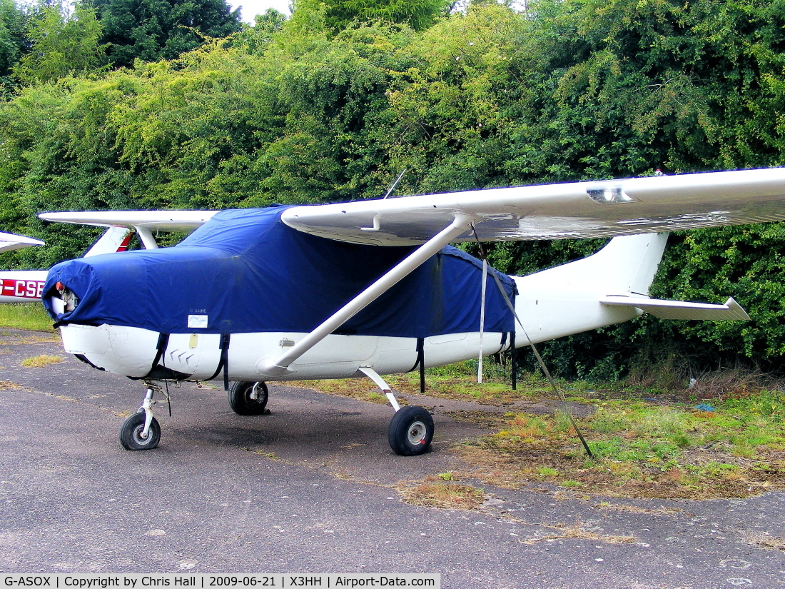 G-ASOX, 1964 Cessna 205A C/N 205-0556, at Hinton in the Hedges. no visible markings, but the cover carries the reg number G-BMHC