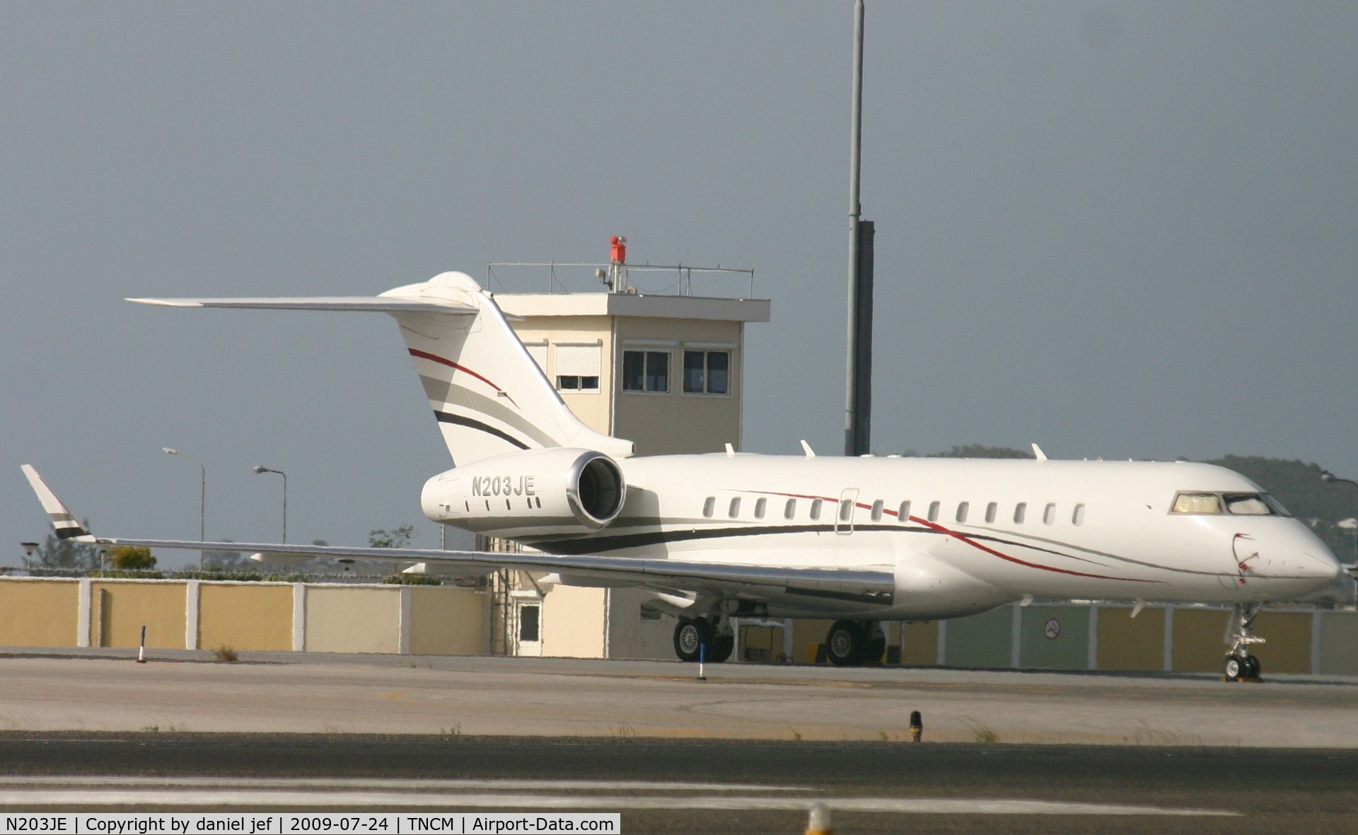 N203JE, 1999 Bombardier BD-700-1A11 Global 5000 C/N 9019, park at the Charly ramp basking in the afternoon sun.