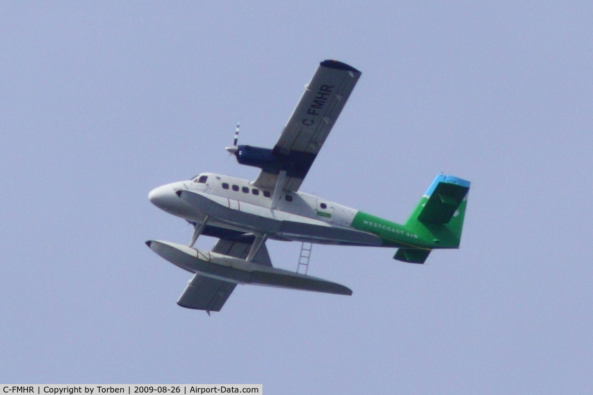 C-FMHR, 1967 De Havilland Canada DHC-6-100 Twin Otter C/N 51, C-FMHR in flight, heading south, over Vancouver. Taken from Jericho Beach, Vancouver, BC.