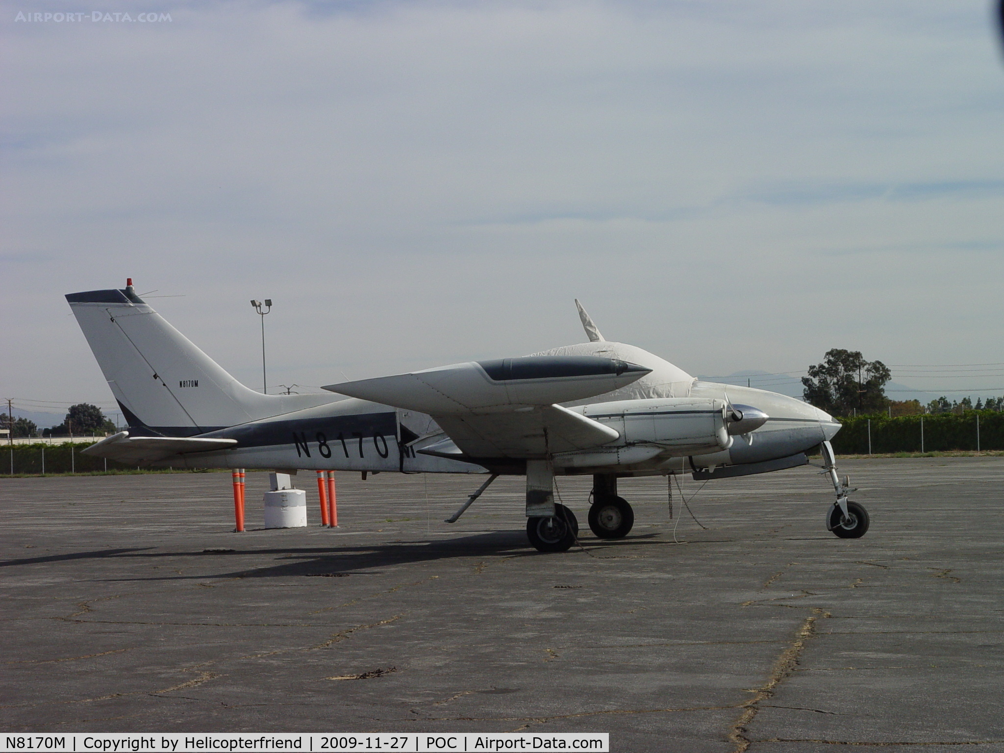 N8170M, 1964 Cessna 310I C/N 310I0170, Tied down, covered and waiting at Howard Aviation