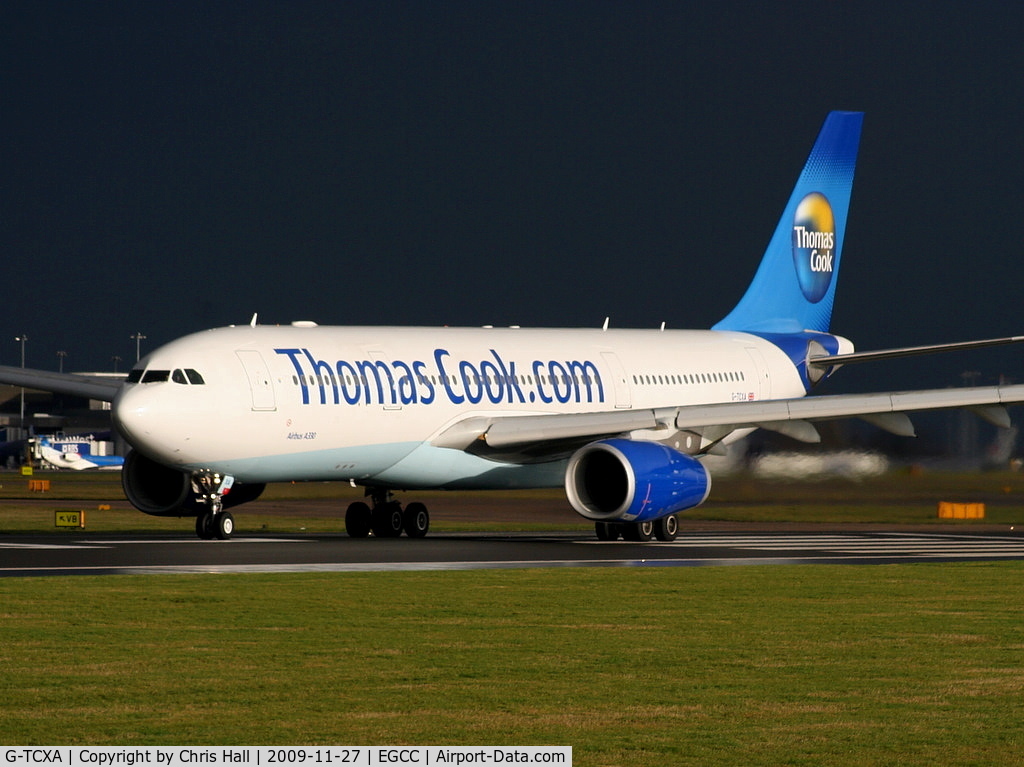 G-TCXA, 2006 Airbus A330-243 C/N 795, Thomas Cook Airlines A330 departing from RW 23L as the storm clouds roll in