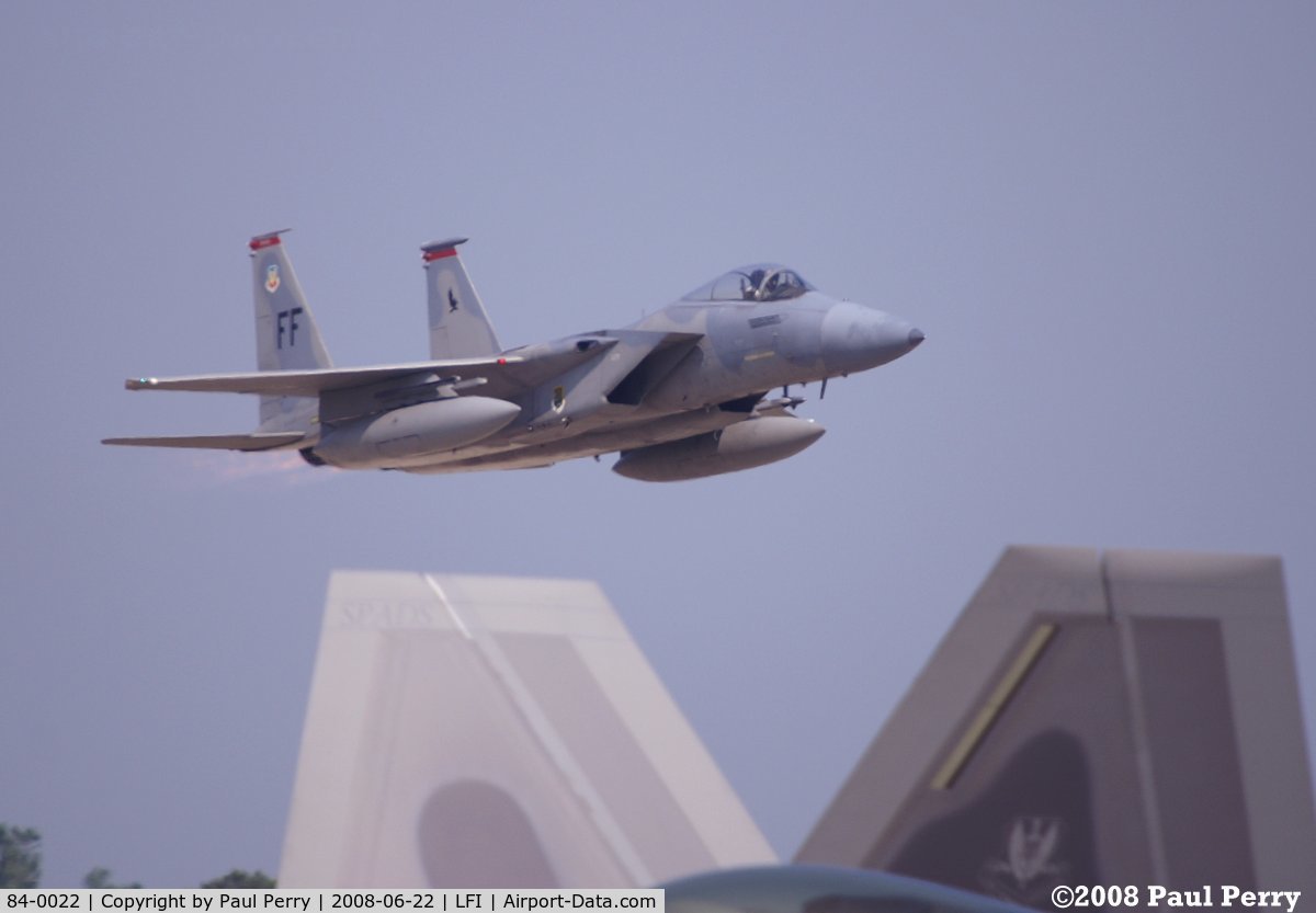 84-0022, 1984 McDonnell Douglas F-15C Eagle C/N 0932/C325, Taking off in full burner, with the Raptor's tail in sight