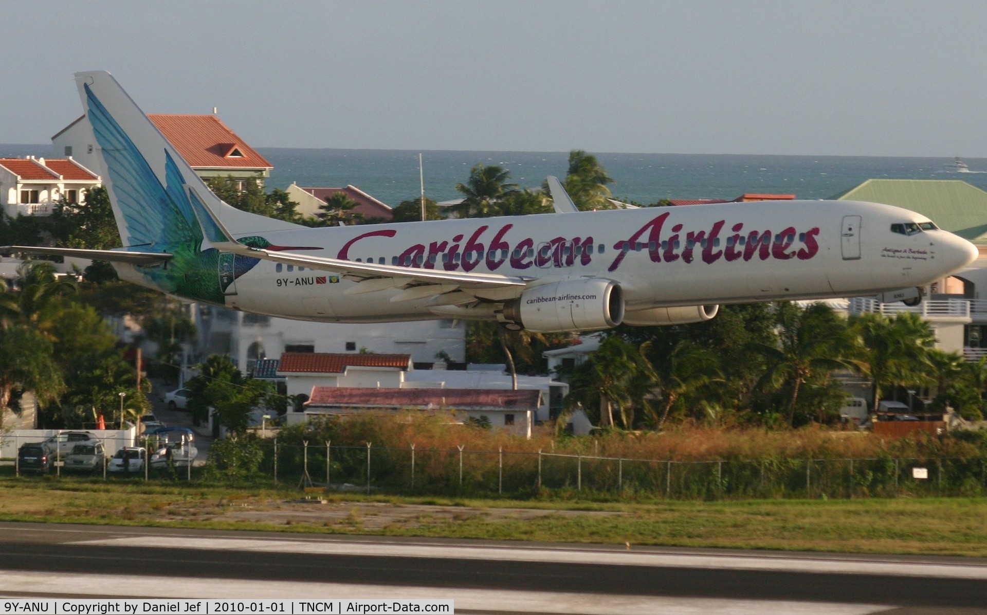 9Y-ANU, 2000 Boeing 737-8Q8 C/N 28235, Caribbean airlines 737 departing TNCM on runway 28 with an early gears up!!!