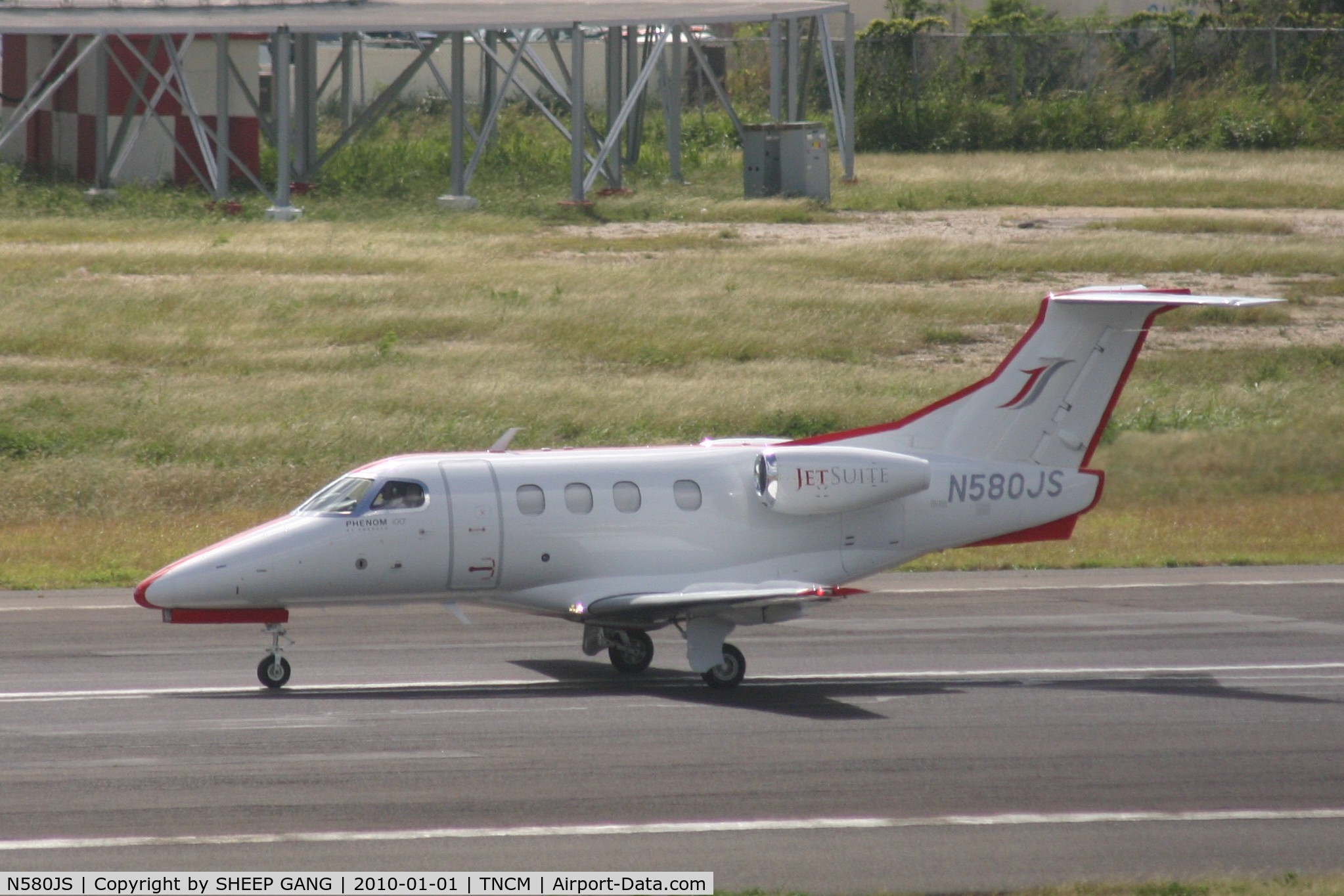 N580JS, 2009 Embraer EMB-500 Phenom 100 C/N 50000079, N580JS on the active departing TNCM