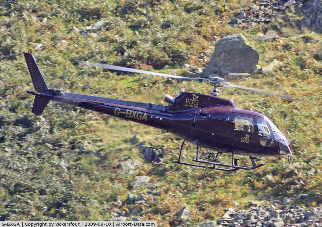G-BXGA, 1991 Aerospatiale AS-350B-2 Ecureuil C/N 2493, PLM Dollar Group. Operating in Dunmail Raise, lifting rocks for the National Parks for pathway maintenance.