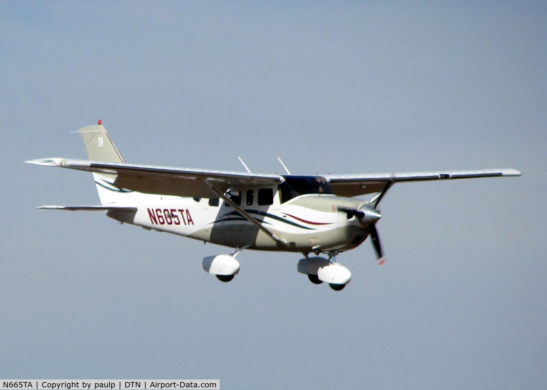 N665TA, 2006 Cessna T206H Turbo Stationair C/N T20608665, Landing on runway 14 at Downtown Shreveport.