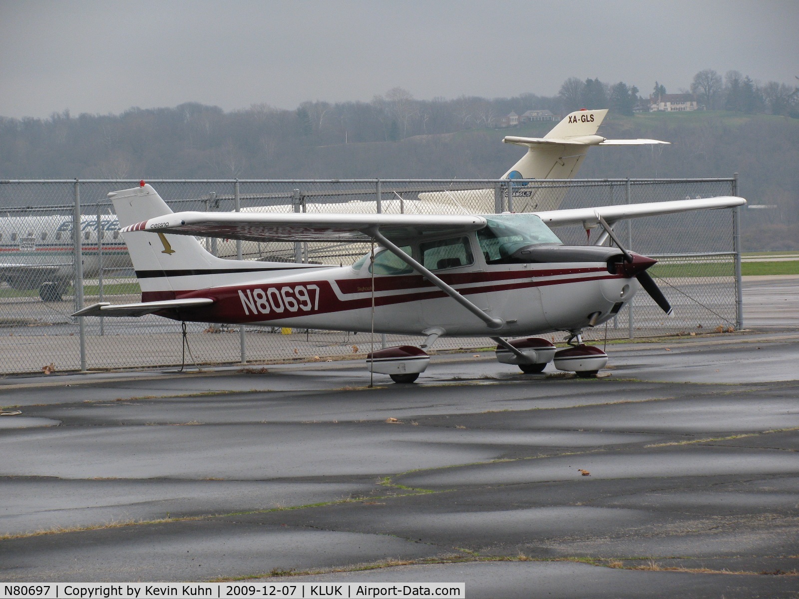 N80697, 1976 Cessna 172M C/N 17266705, A Lunken resident with an exotic visitor behind.