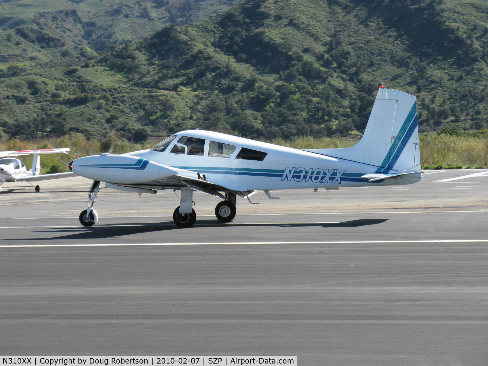 N310XX, 1956 Cessna 310 C/N 35411, 1956 Cessna 310, two Continental IO-470 260 Hp each, landing roll Rwy 04