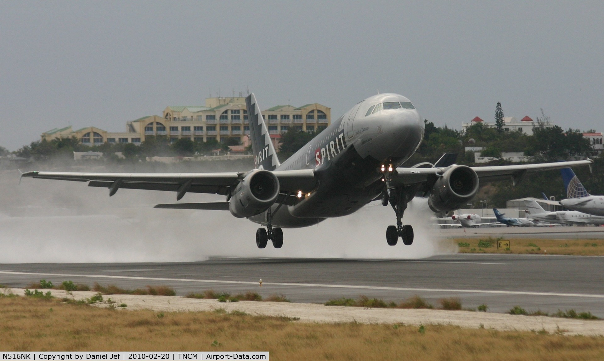 N516NK, 2006 Airbus A319-132 C/N 2704, N516NK spirit wings departing TNCM on a wet day