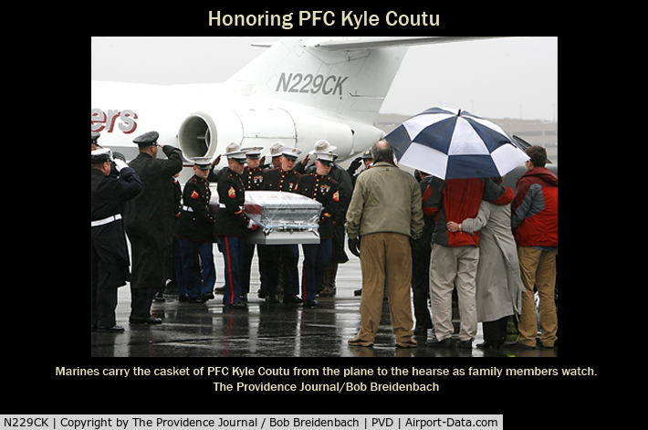 N229CK, 1970 Dassault Fan Jet Falcon (20D) C/N 229, Family members of Marine Pfc. Kyle J. Coutu, of Pawtucket, watch as his casket is taken from a private jet after arriving Wednesday 2/24/2010 at T.F. Green Airport in Warwick. Coutu was killed in combat in Afghanistan.