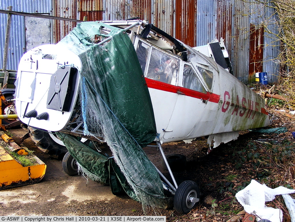 G-ASWF, 1964 Beagle A-109 Airdale C/N B.537, remains of Beagle A.109 Airedale behind one of the hangars