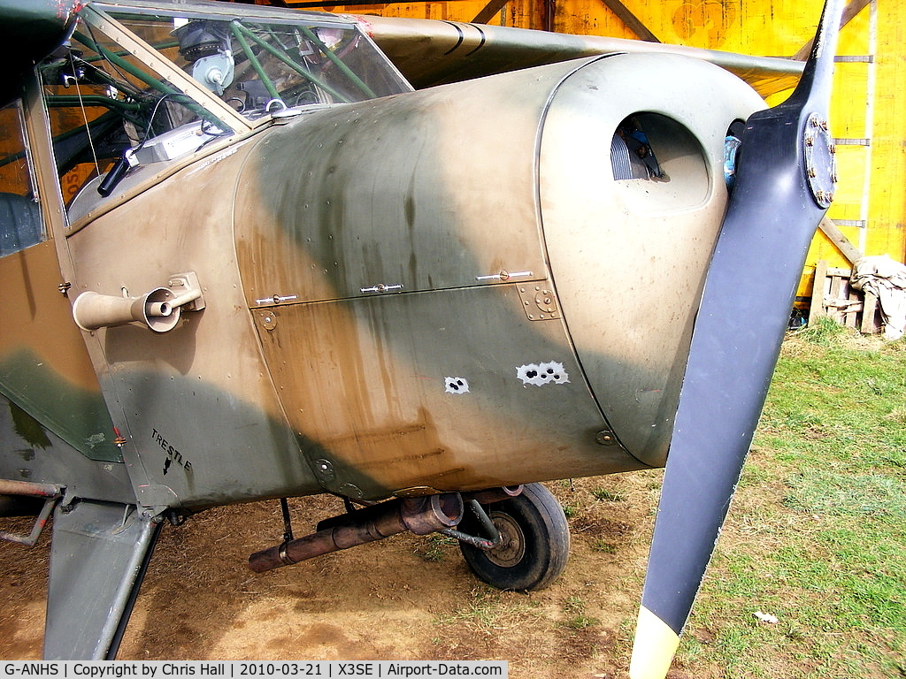 G-ANHS, 1942 Taylorcraft G Auster 4 C/N 737, with fake bullet holes in the engine cover