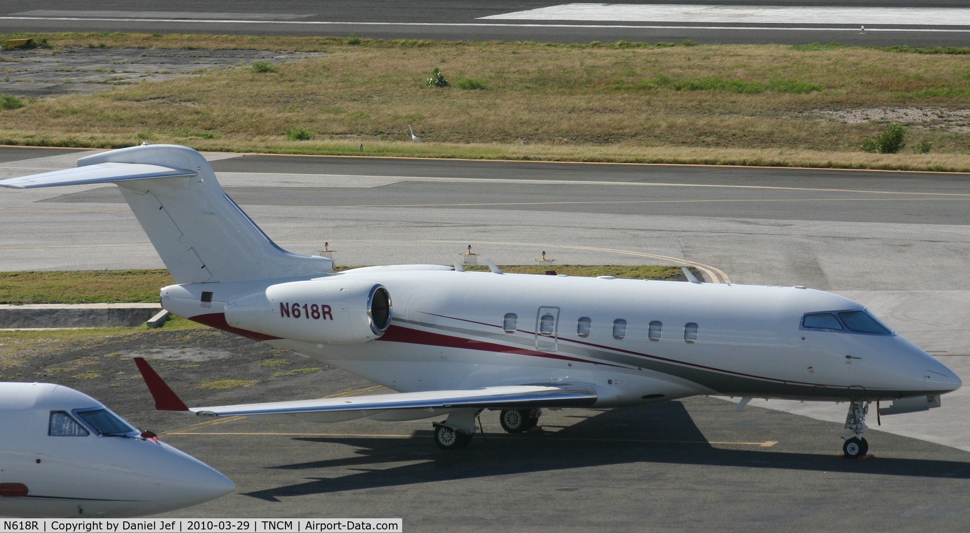 N618R, 2005 Bombardier Challenger 300 (BD-100-1A10) C/N 20045, N618R park at THE cargo ramp at TNCM