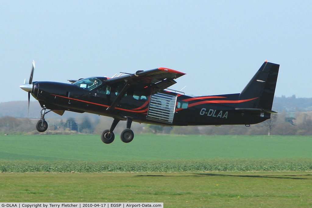 G-DLAA, 2003 Cessna 208 Caravan I C/N 20800367, Cessna Caravan takes off with skydivers on a pleasant day at Peterborough Sibson