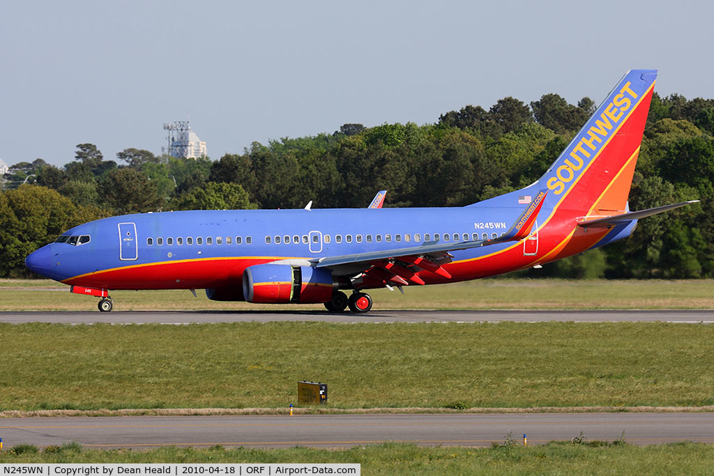 N245WN, 2006 Boeing 737-7H4 C/N 32506, Southwest Airlines N245WN (FLT SWA3760) rolling out on RWY 5 after arrival from Jacksonville Int'l (KJAX).
