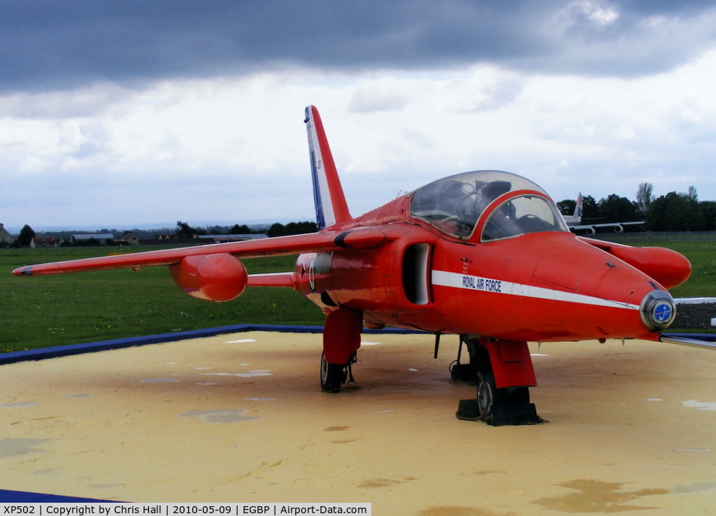 XP502, 1962 Folland Gnat T.1 C/N FL517, Gnat T1 first entered service with 4FTS in 1962, preserved in front of the tower in Red Arrows colours although it never flew with them.