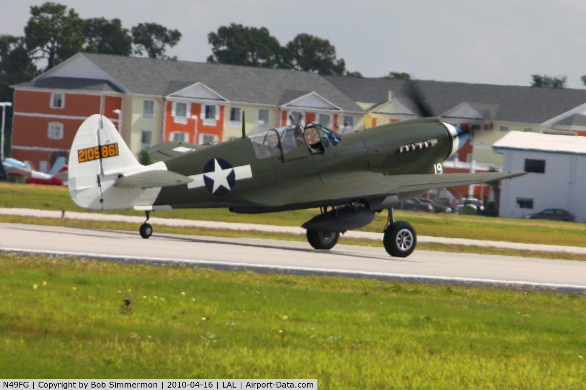 N49FG, 1943 Curtiss P-40N Warhawk C/N 29623, Departing Lakeland, Florida during Sun N Fun 2010.