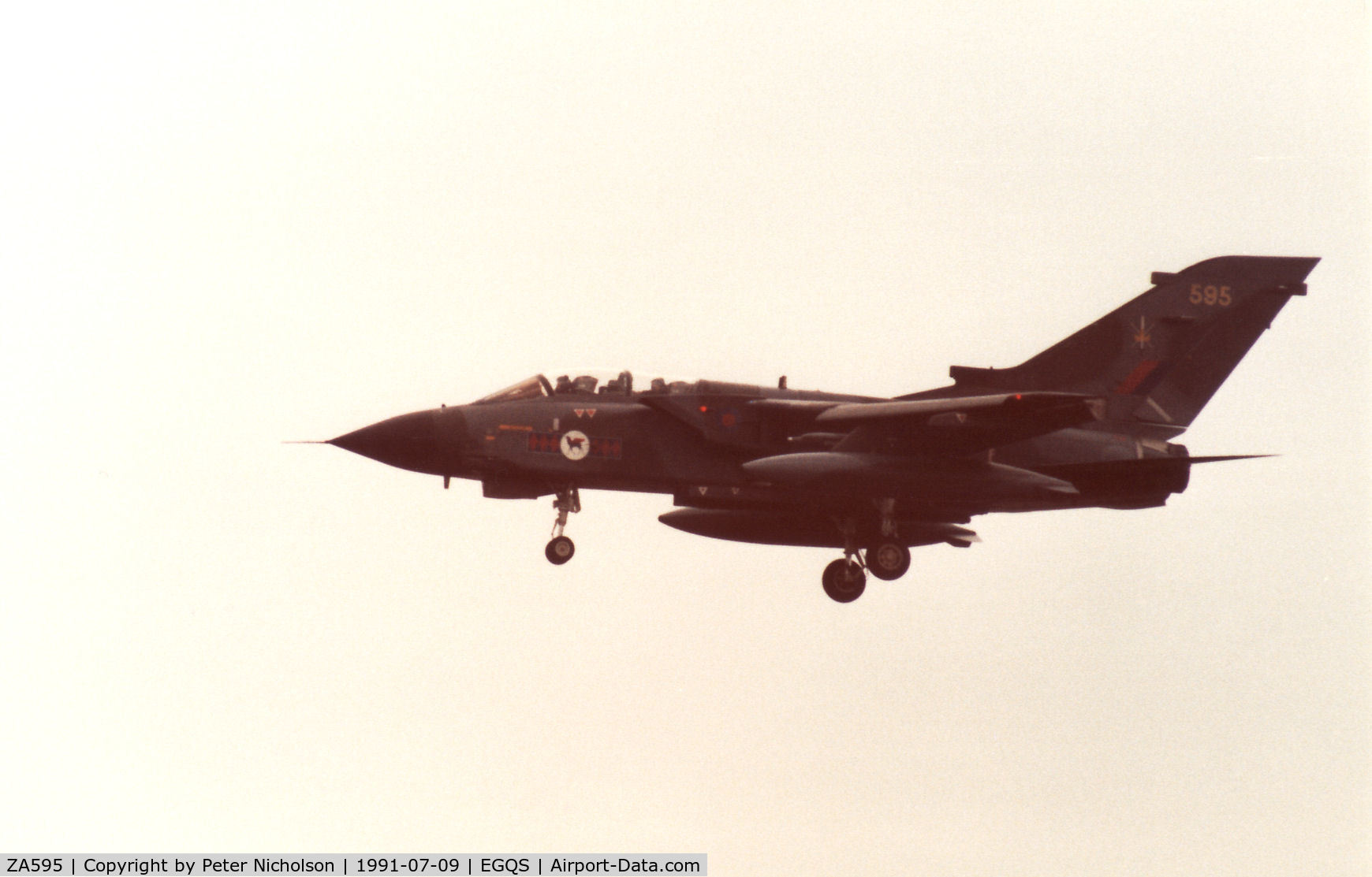 ZA595, 1982 Panavia Tornado GR.1 C/N 112/BT023/3059, Tornado GR.1, callsign Magnum 1, of RAF Honington's Tactical Weapons Conversion Unit on final approach to RAF Lossiemouth in the Summer of 1991.