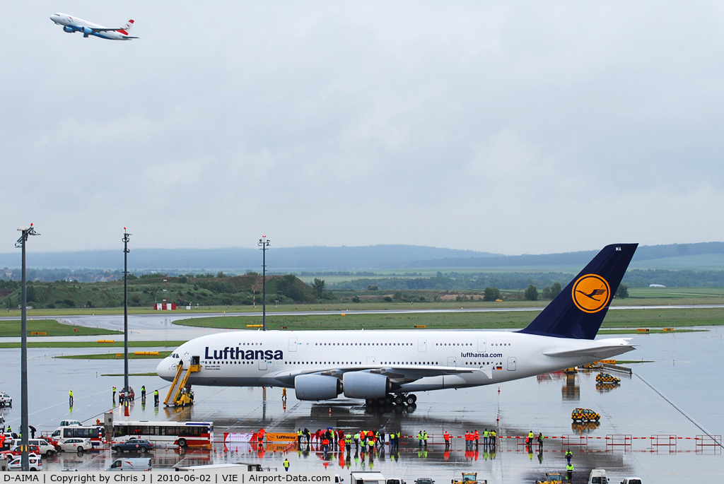 D-AIMA, 2010 Airbus A380-841 C/N 038, Size comparison: Lufthansa A380 (D-AIMA) with Austrian A320 (OE-LBR) departing.