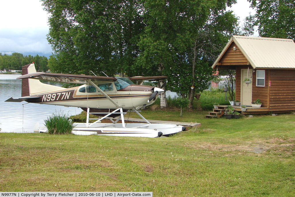 N9977N, 1976 Cessna 180J C/N 18052632, 1976 Cessna 180J, c/n: 18052632 on a pleasant dock at Lake Hood