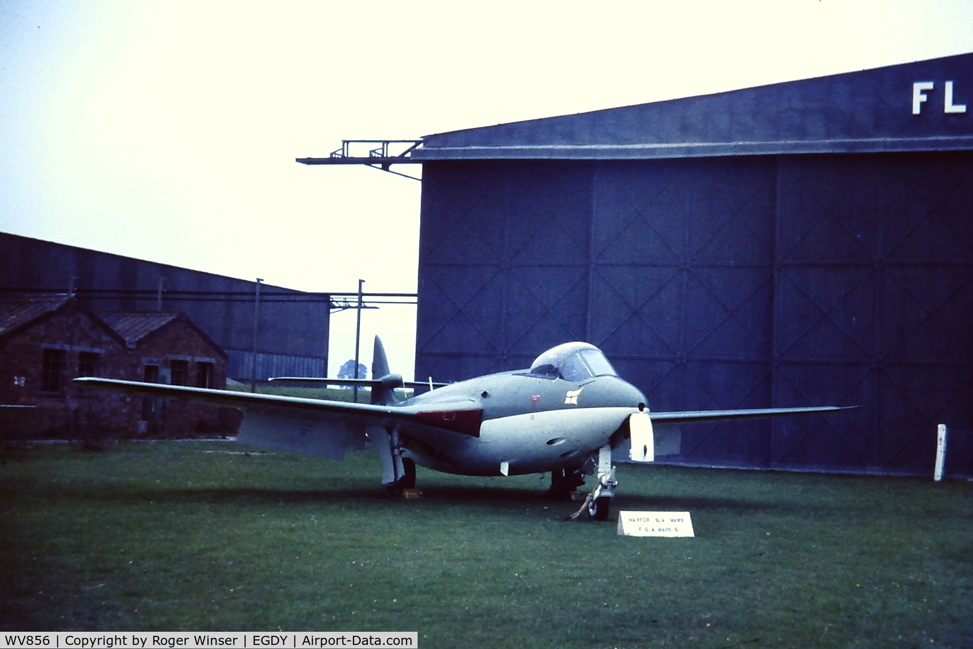 WV856, 1954 Hawker Sea Hawk FGA.6 C/N 6101, Parked outside a hangar of the Fleet Air Arm museum at RNAS Yeovilton in late 1960's/early 1970's. Painted in the green/white Admirals Barge colour scheme when the aircraft was operated by 781 NAS.