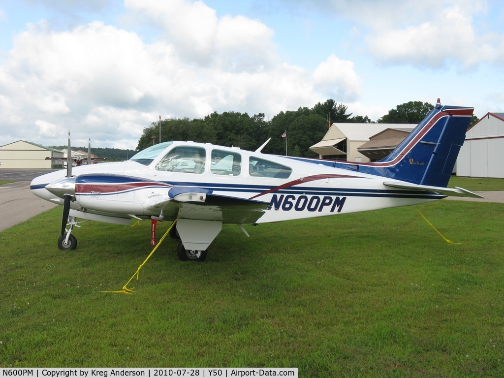 N600PM, 1977 Beech 95-B55 (T42A) Baron C/N TC-2082, Beech 55 Baron in the grass.