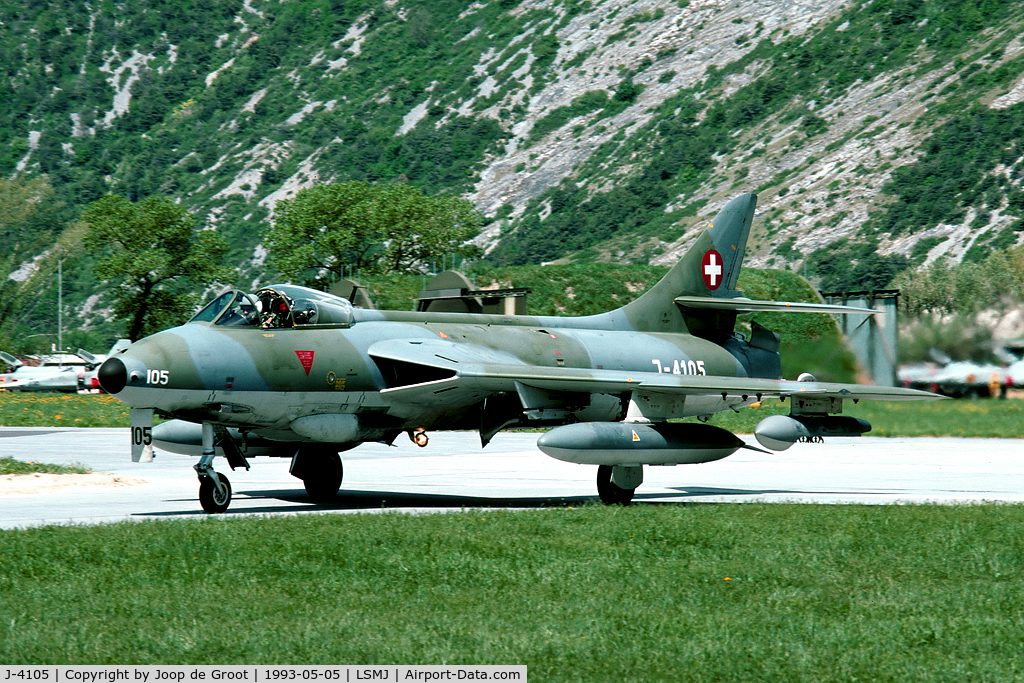 J-4105, 1956 Hawker Hunter F.58A C/N HABL-003074, This Hunter returns from one of the missions during WK93. Watch all those F-5's in the background. It is hardly imaginable how the Swiss AF housed over 25 aircraft in a cave..!