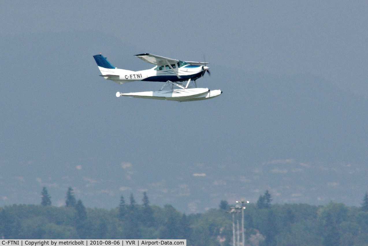 C-FTNI, 1964 Cessna 182G Skylane C/N 18255208, landing on a hot hazy day