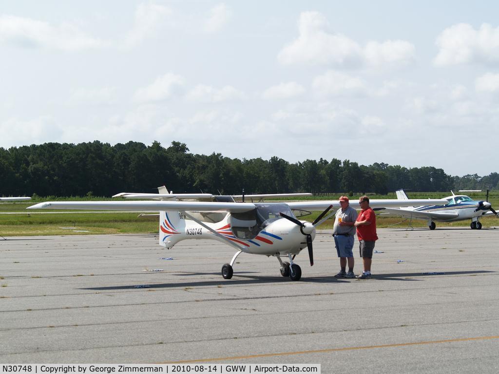 N30748, 2006 Fantasy Air Allegro 2000 C/N 06-223, Pilot discusses aircraft with Goldsboro-Wayne employee