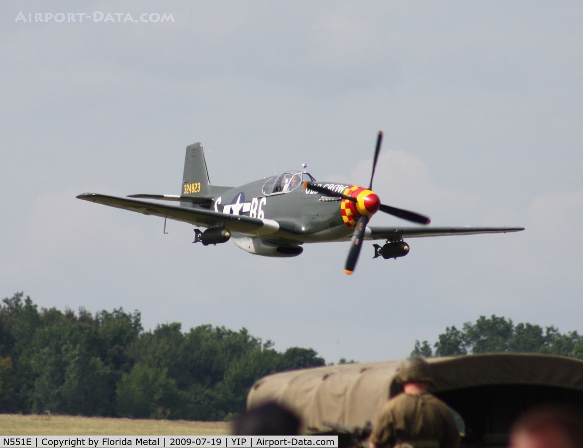 N551E, 1943 North American P-51B-1NA Mustang C/N 102-24700, Roush's P-51B Old Crow flying low over WWII reinactors