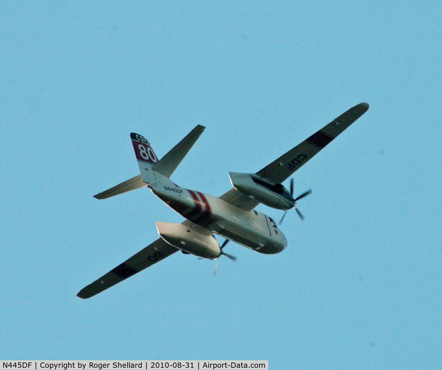 N445DF, Grumman S2F-1 Tracker C/N 152, One of two circling a fire in Soquel CA as it passed over our house late afternoon sun was a problem so had to let it pass over  hence rear shot