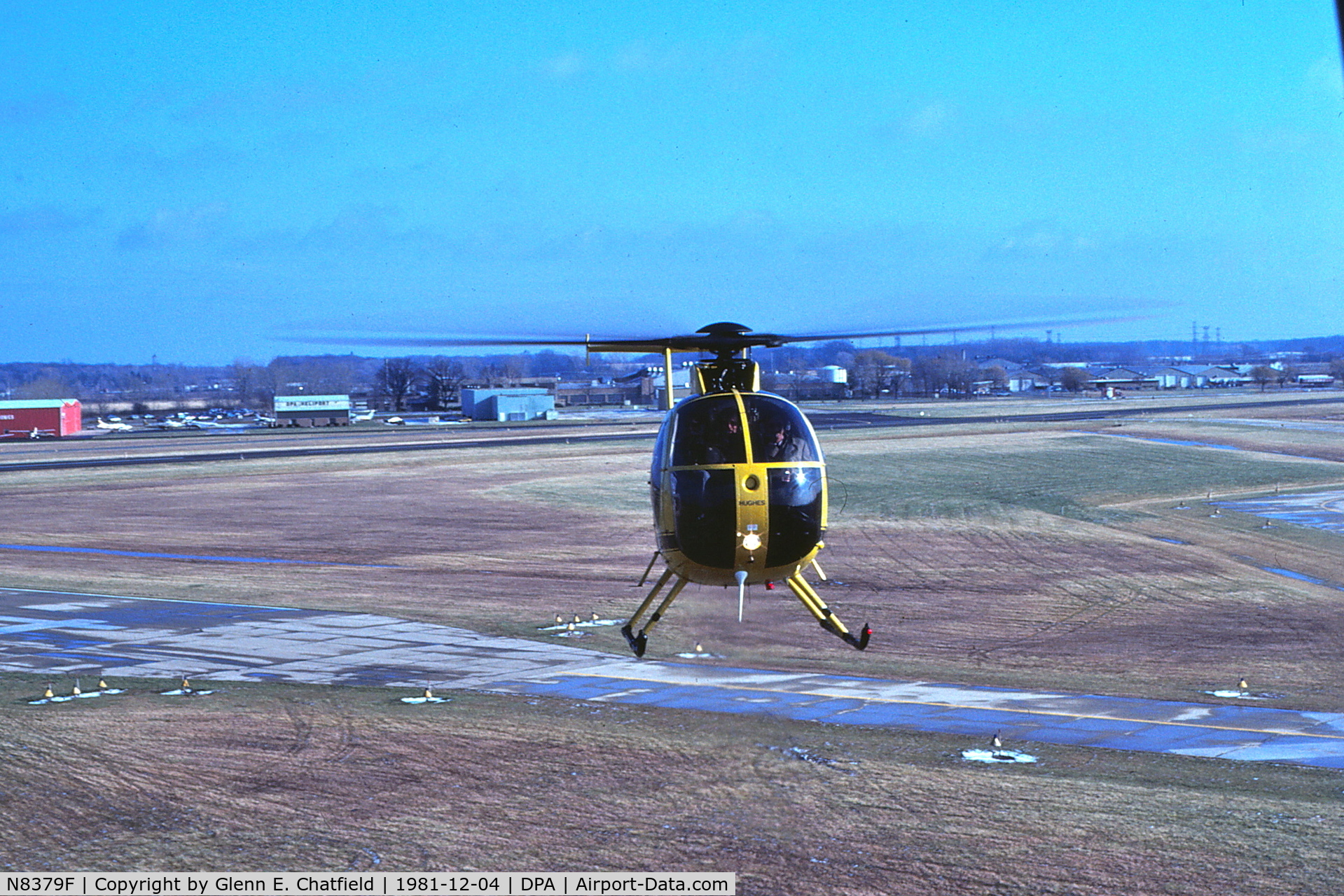 N8379F, 1978 Hughes 369D C/N 480291D, Looking SE from the control tower - the chopper was giving rides to the controllers