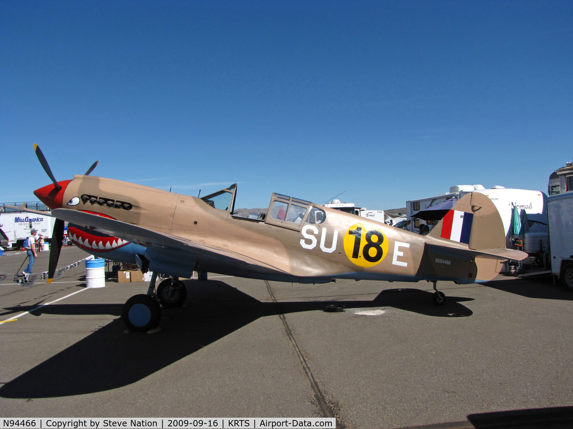 N94466, 1942 Curtiss P-40E C/N AK-899, Race #18 is a sharkmouth P-40E (as NX94466) with desert camo and 