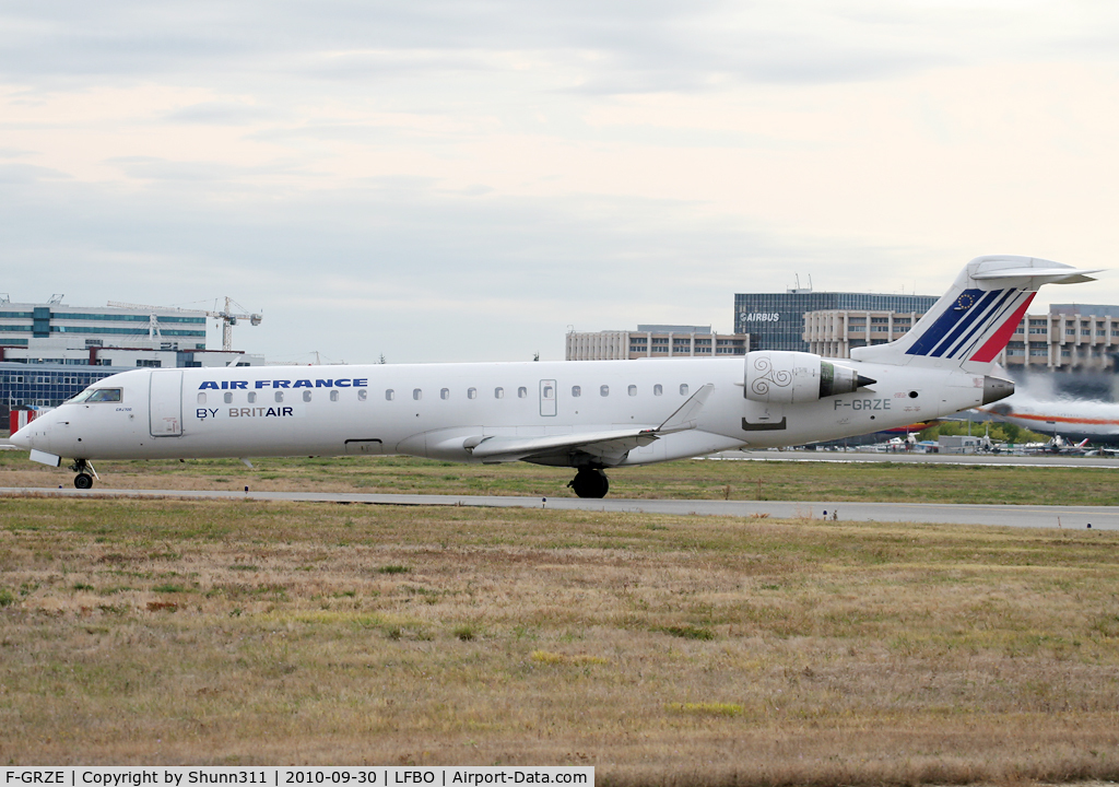F-GRZE, 2001 Canadair CRJ-702 (CL-600-2C10) Regional Jet C/N 10032, Taxiing holding point rwy 32R for departure with new midified titles and logo...