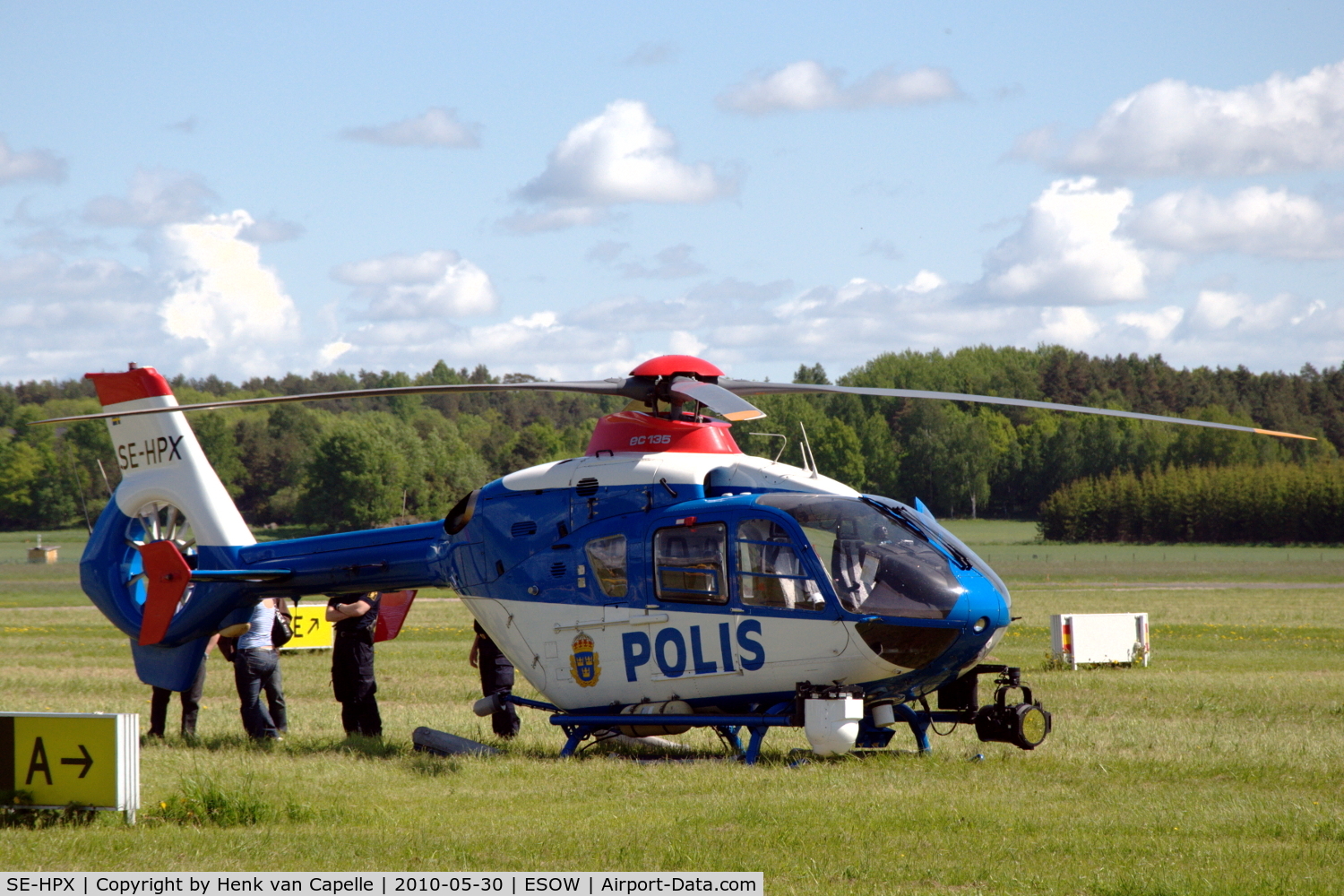 SE-HPX, 2002 Eurocopter EC-135P-2+ C/N 0240, A police EC135 parked in the grass at Västerås Hässlö airport, Sweden.