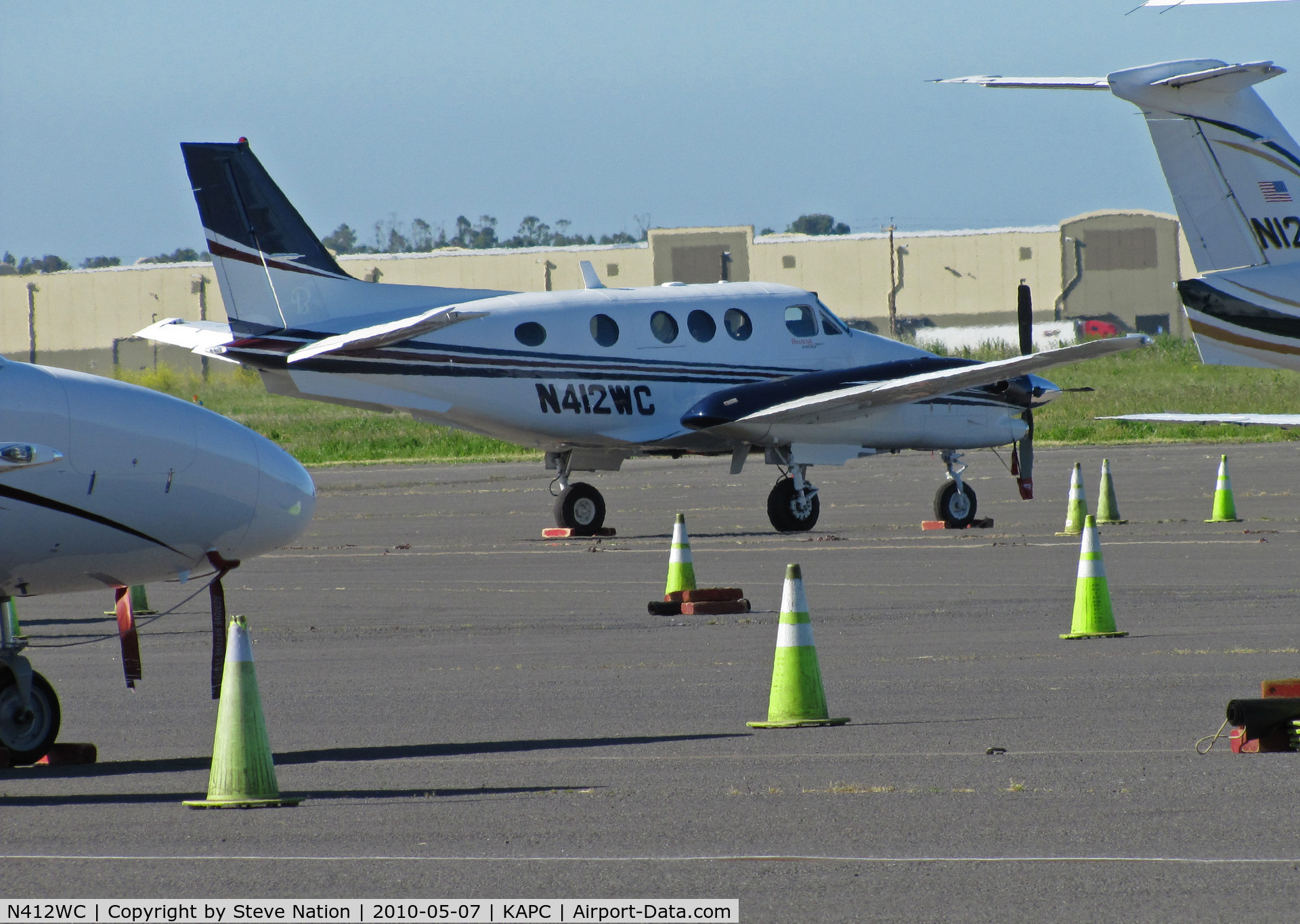 N412WC, Hawker Beechcraft Corp C90GTI King Air C/N LJ-1916, Surrounded by the yellow cones - Wilson Construction of Canby, OR operates this King Air C90GTI