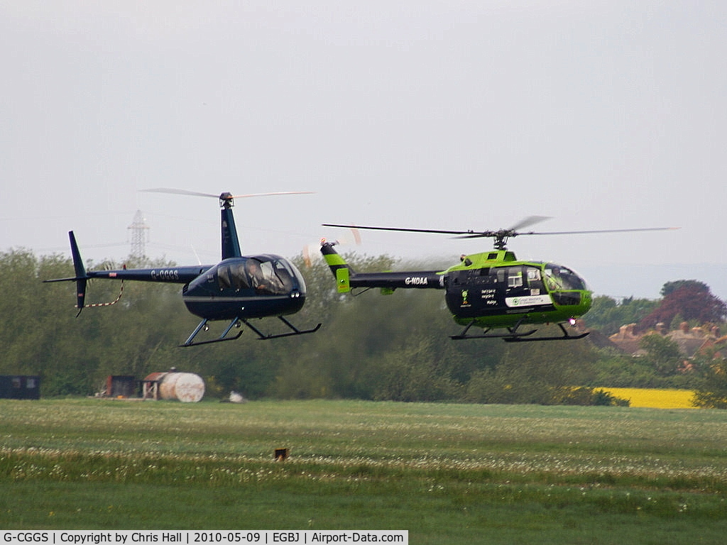 G-CGGS, 2009 Robinson R44 Raven II C/N 12967, Robinson R44 Raven II, G-CGGS with G-NDAA Bolkow BO 105DBS-4 in the background