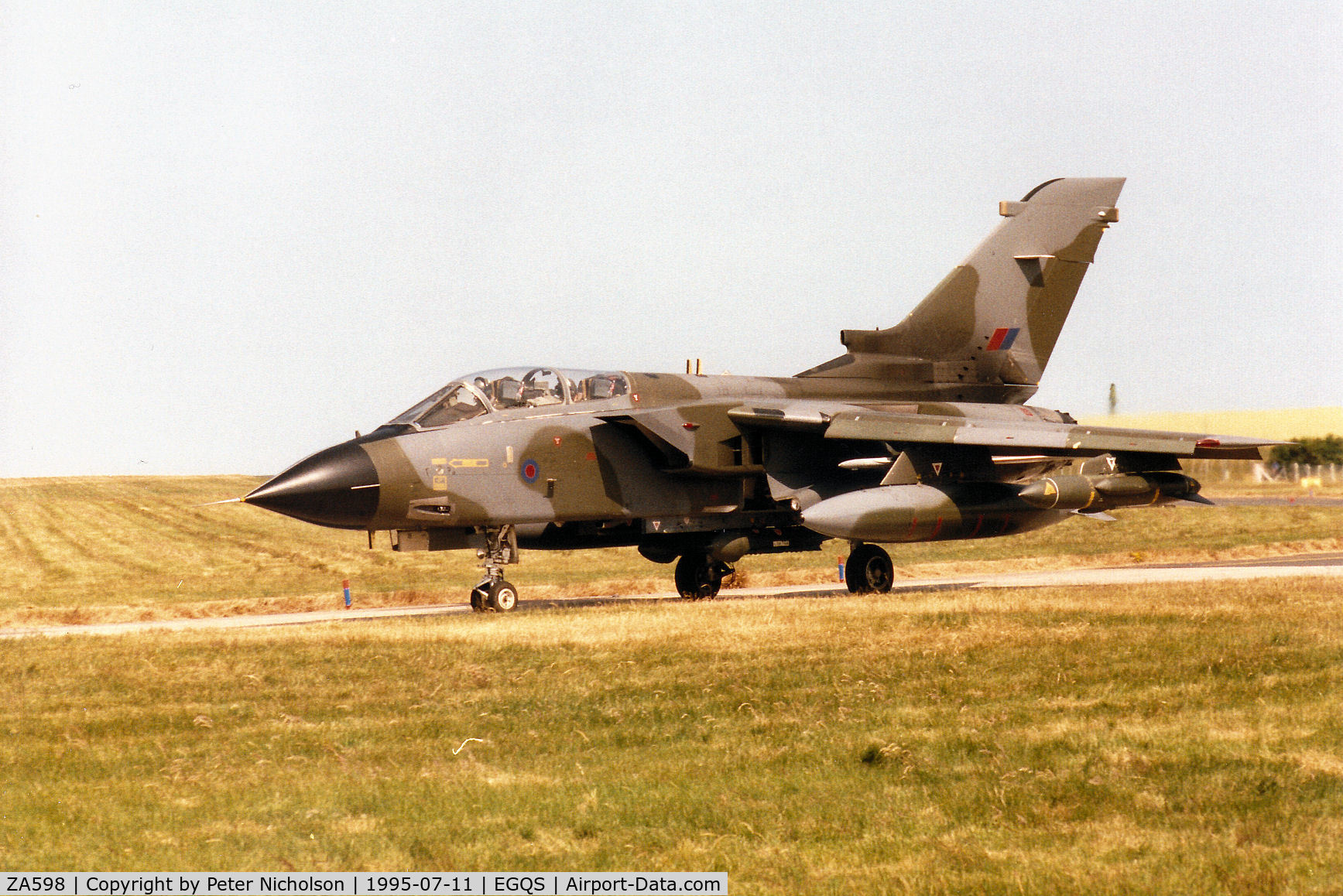 ZA598, 1982 Panavia Tornado GR.1 C/N 118/BT024/3062, Tornado GR.1B, callsign Saxon 1, of 617 Squadron taxying to the active runway at RAF Lossiemouth in the Summer of 1995.