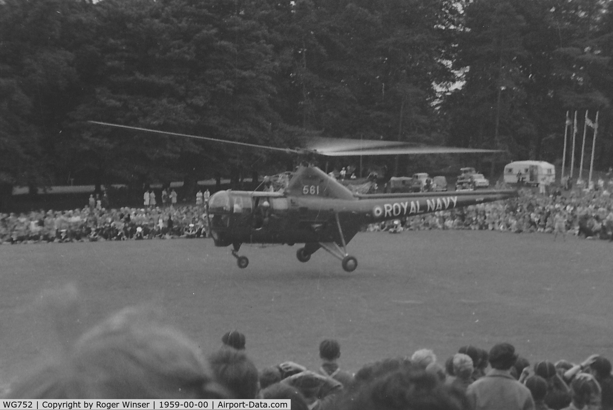 WG752, Westland Dragonfly HR.5 C/N WA/H/62, Off airport. Fleet Air Arm Dragonfly HR.3 helicopter coded 561 of 727 NAS's ASR Flight  based at RNAS Brawdy (HMS Goldcrest), Pembrokeshire seen during a rescue demonstration in Singleton Park, Swansea, Wales, UK circa 1959.
