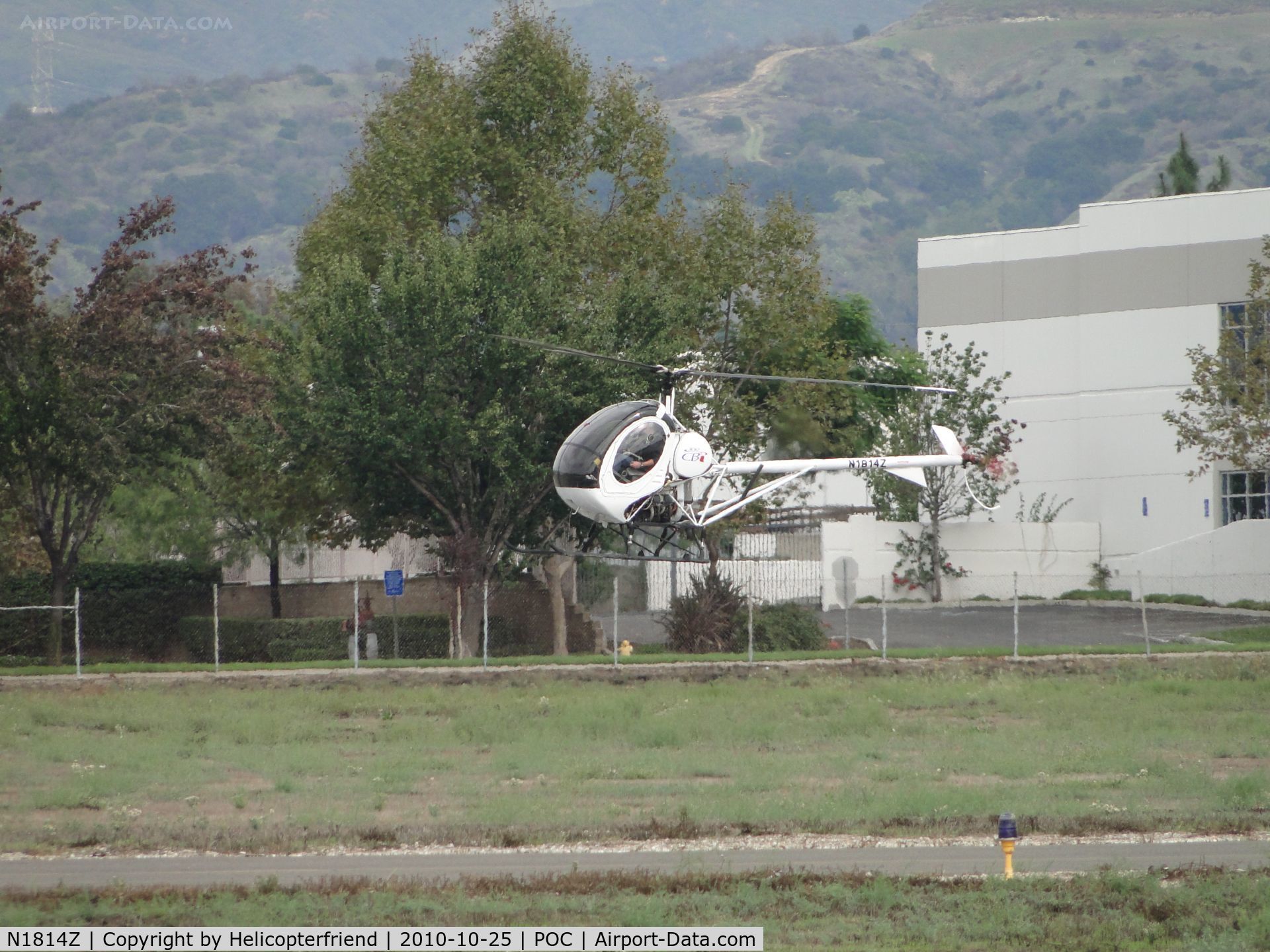 N1814Z, 2007 Schweizer 269C-1 C/N 0304, Hovering over helicopter practice area