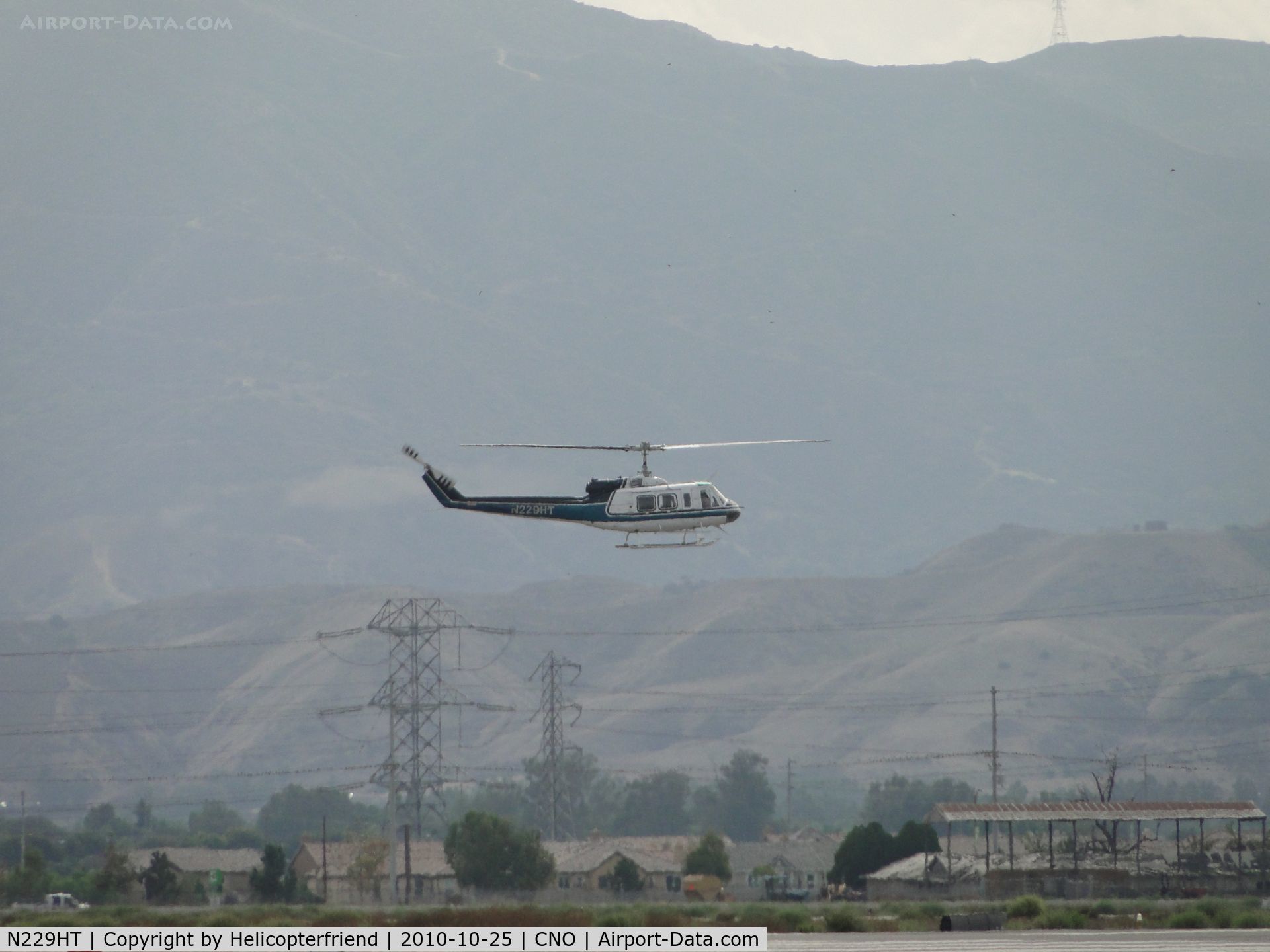 N229HT, 1980 Bell 205A-1 C/N 30330, Gaining altitude for downwind leg for another approach