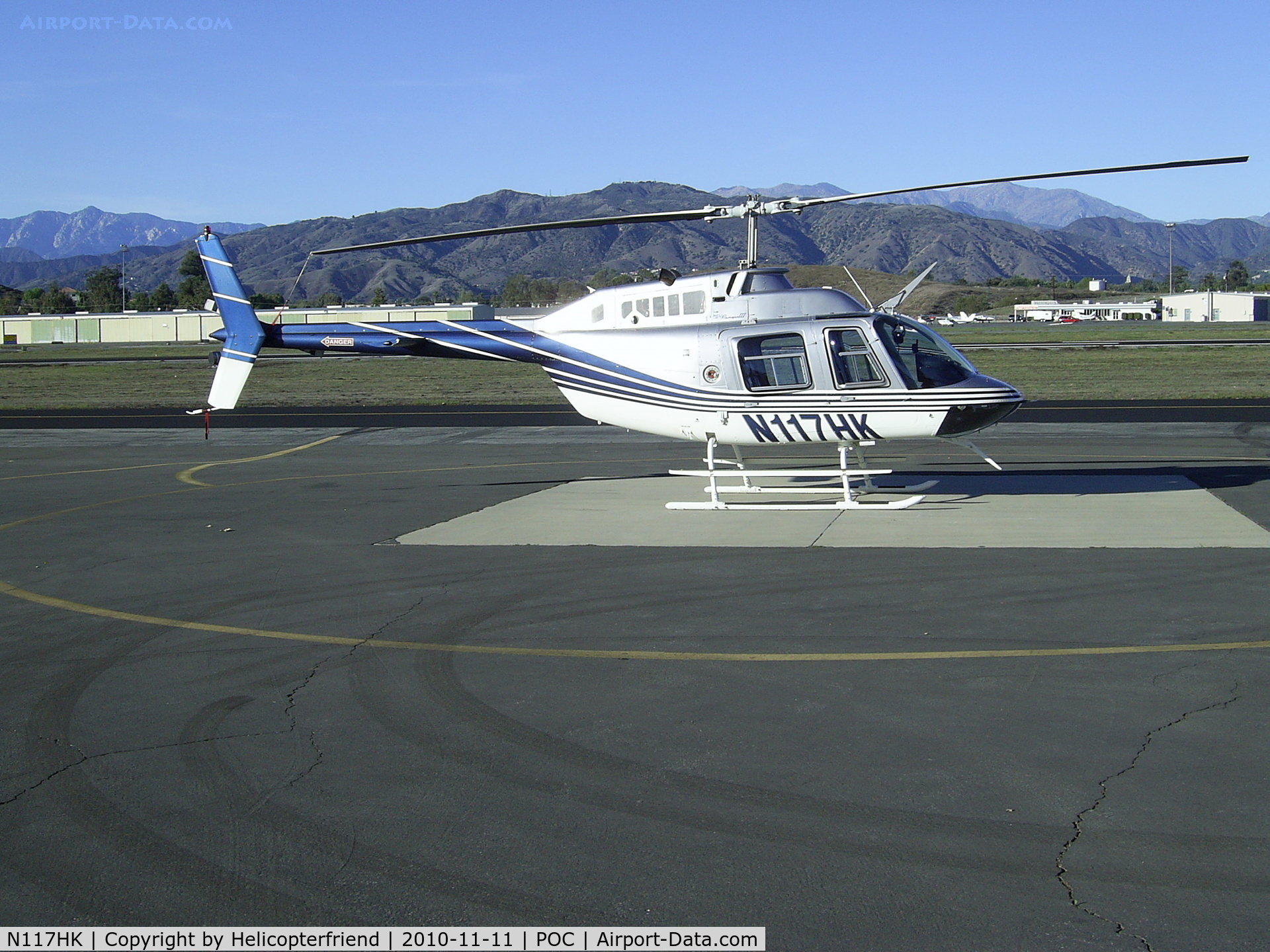 N117HK, 1997 Bell 206B JetRanger III C/N 4462, Parked at west helipad and visiting the drag races at LACO Fairplex