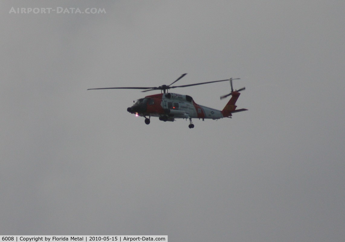 6008, Sikorsky MH-60J Jayhawk C/N 70.1565, MH-60J Coast Guard flying along Passe A Grille Beach south of St. Pete FL at dusk