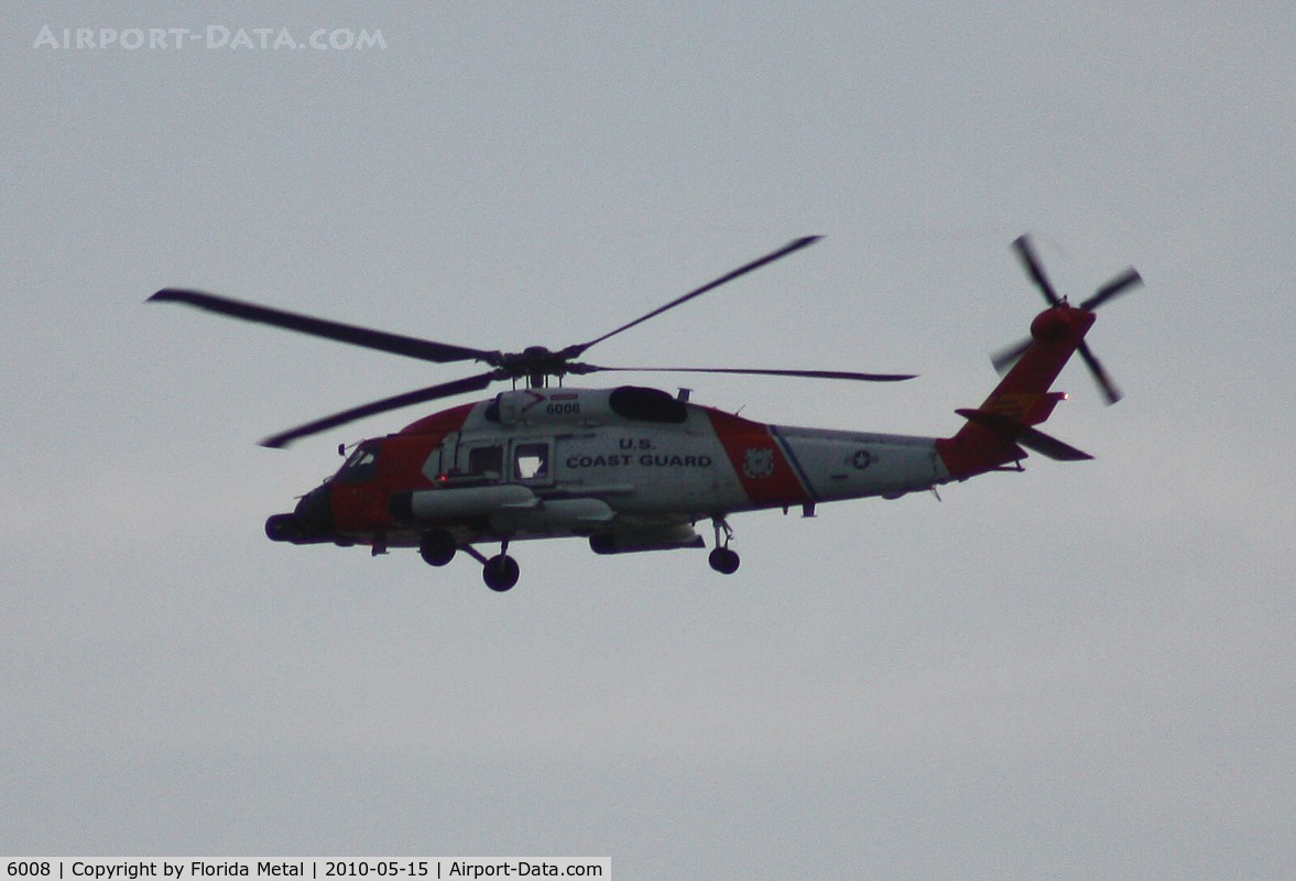 6008, Sikorsky MH-60J Jayhawk C/N 70.1565, Coast Guard MH-60J flying along Passe A Grille Beach by St. Pete before dark