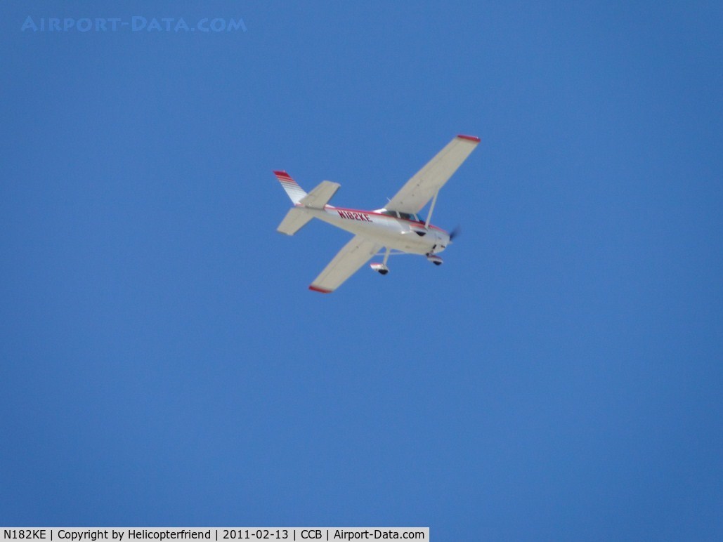 N182KE, 1975 Cessna 182P Skylane C/N 18263657, Crossing the airport above 2500 ft and heading north east